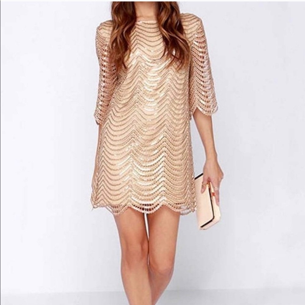 Gold sequined dress. Roaring 20’s.
